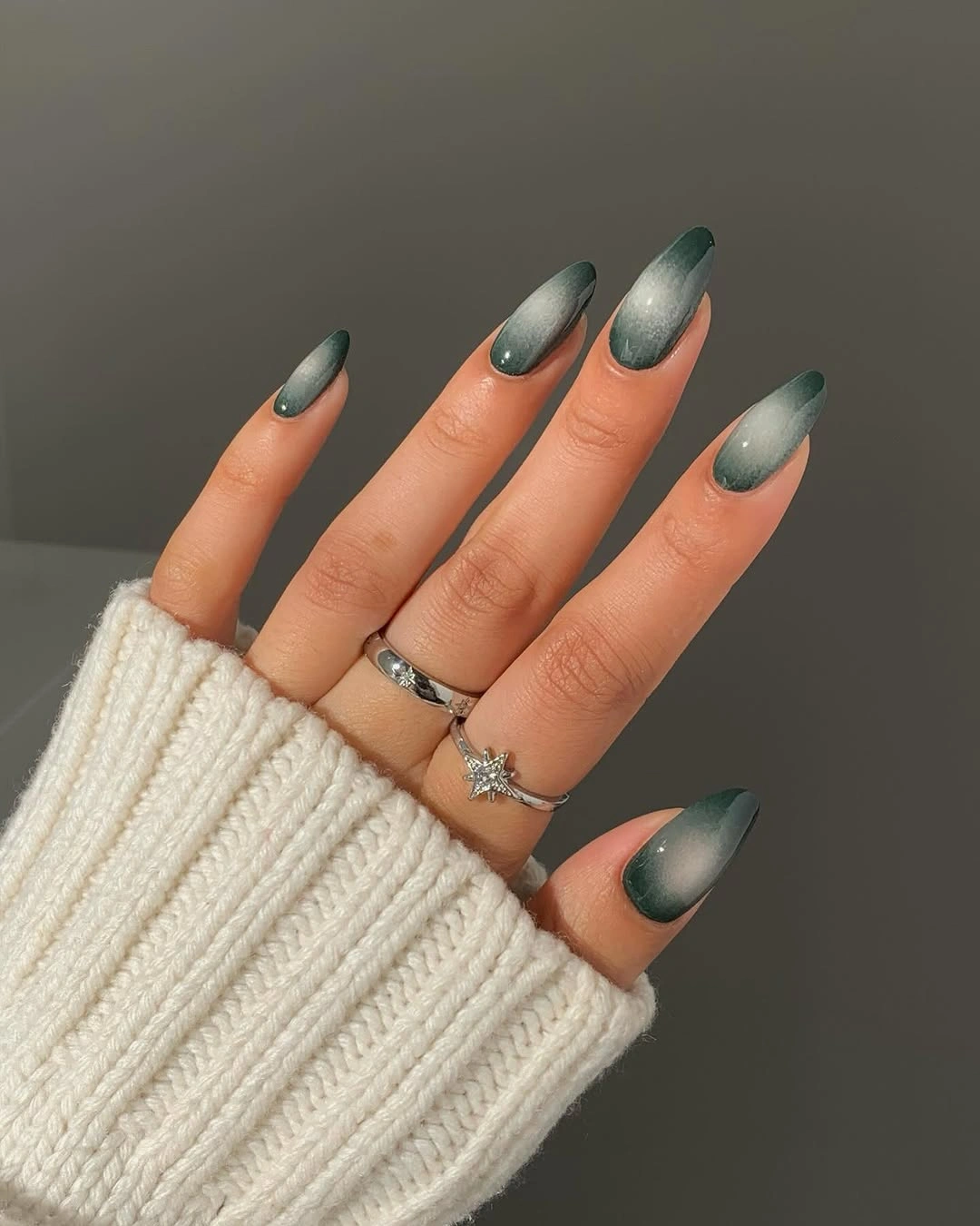 Almond sage green nails with smoky reflective gradient