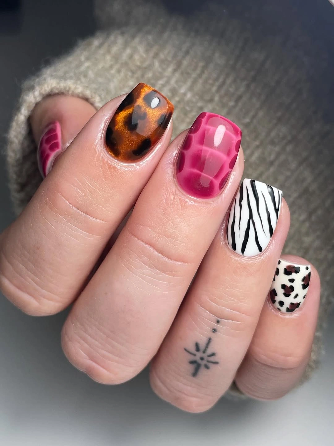 Short hot pink brown and animal print nail design