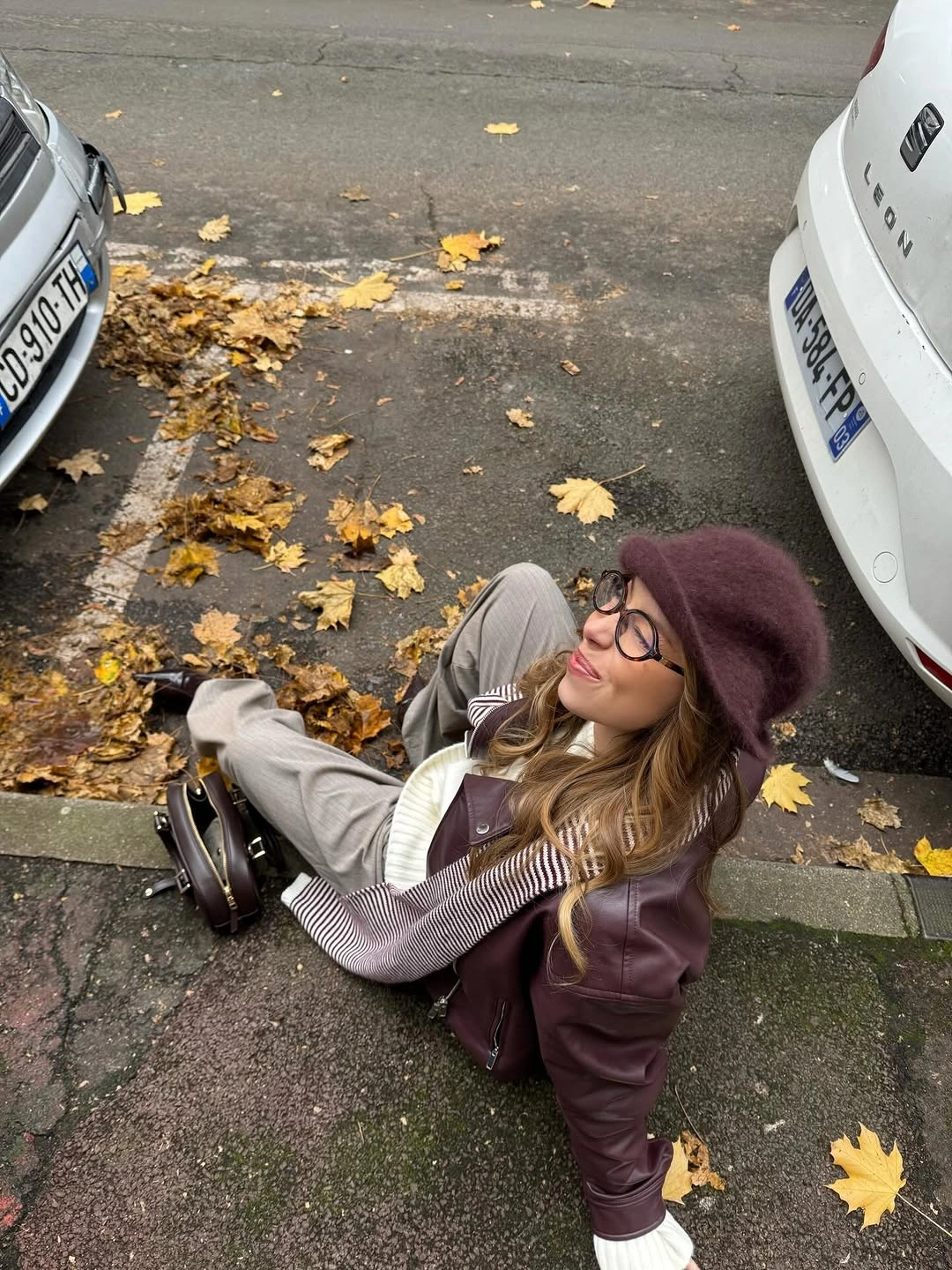 Burgundy beret striped top khaki trousers and brown boots