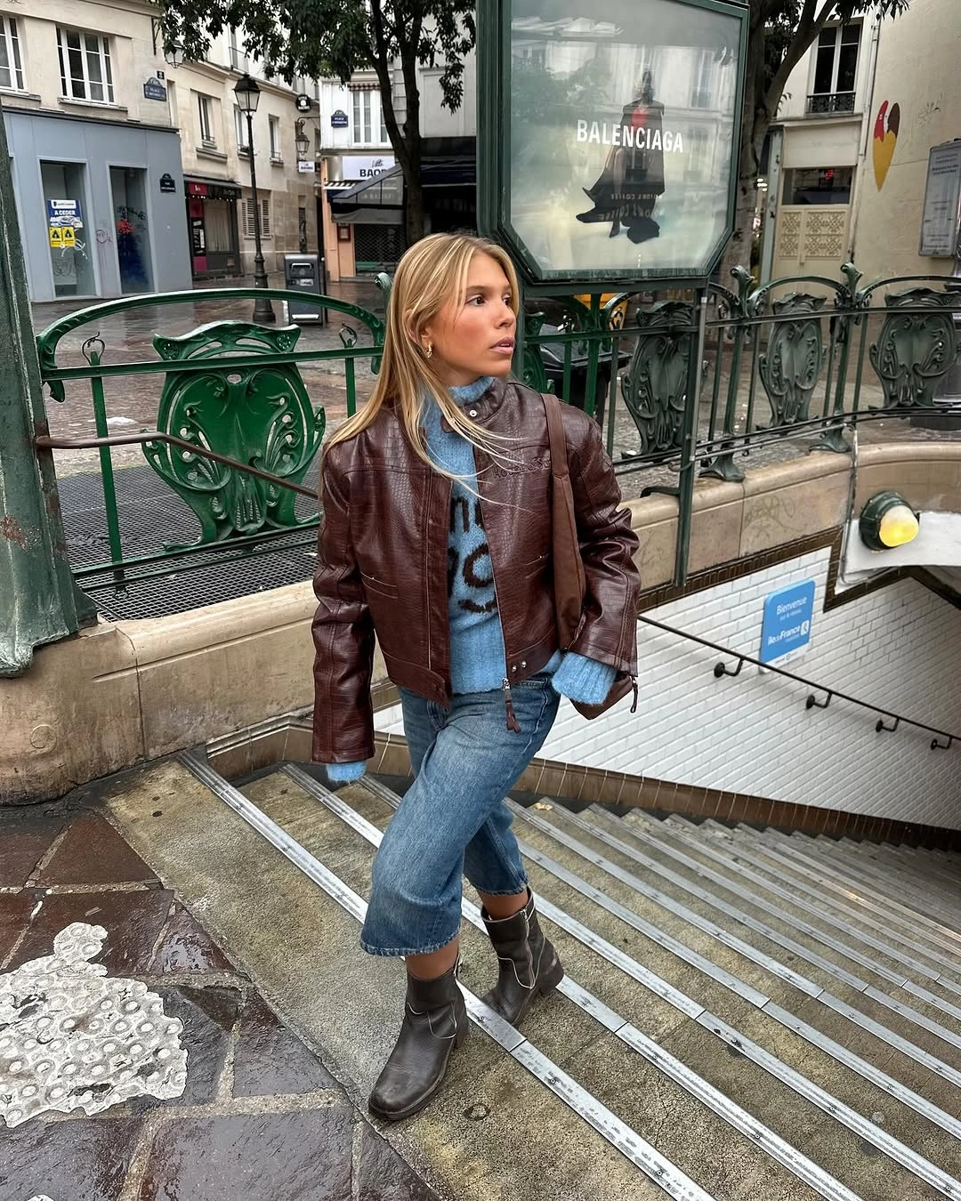 Brown jacket with blue jeans and soft gray scarf