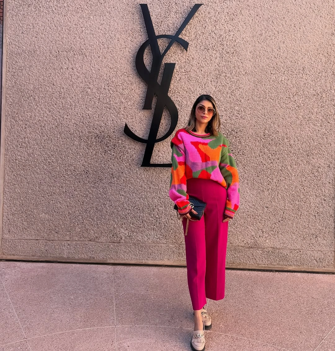 Pink and green graphic sweater with vivid magenta trousers