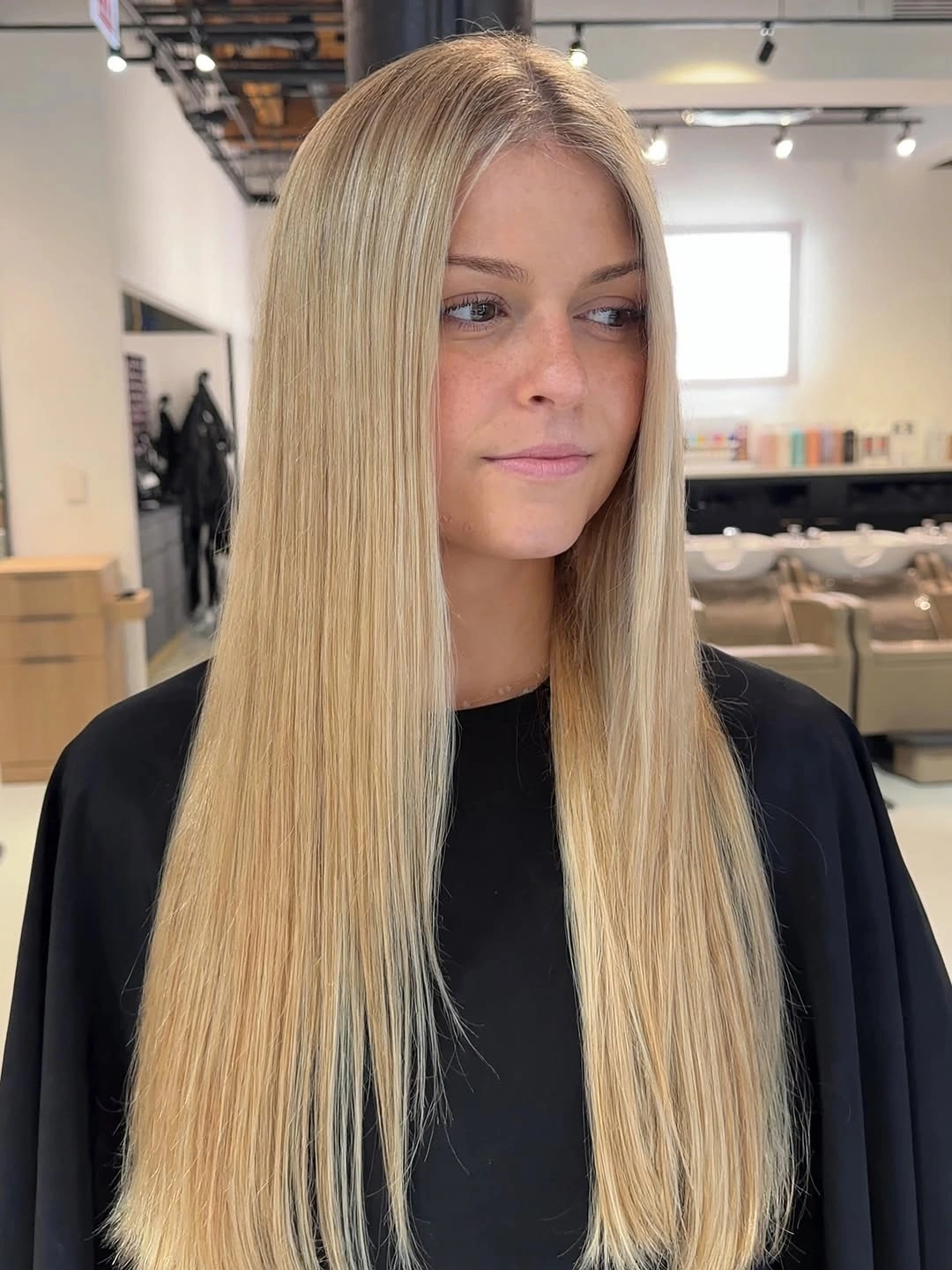 Very long straight honey blonde hair with center part