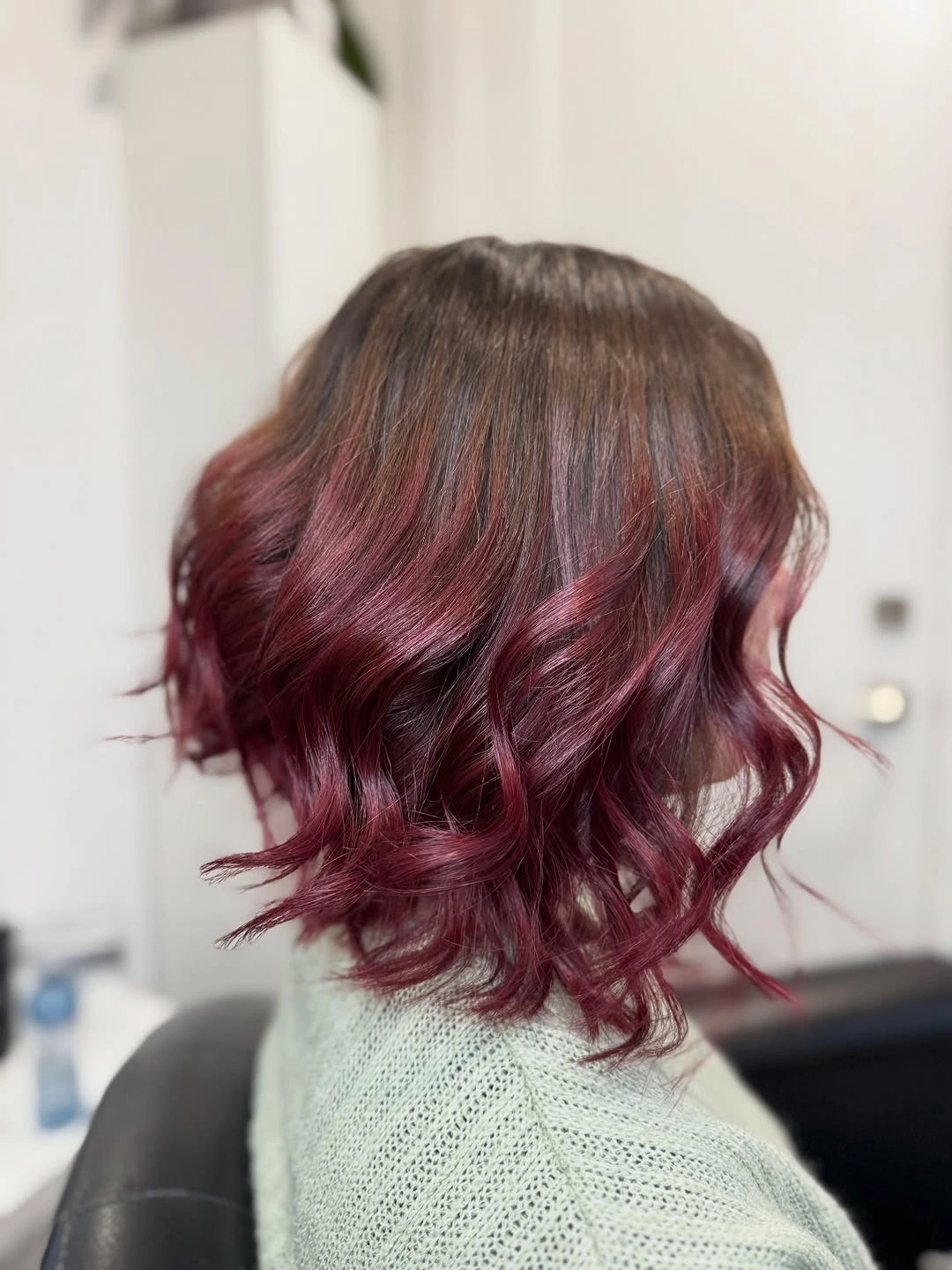 Short burgundy bob with loose textured waves