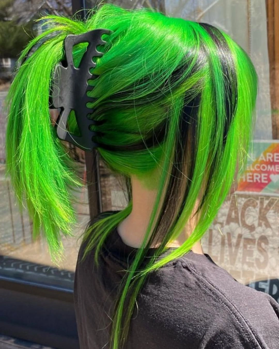 Neon green layered hair with bold black panels