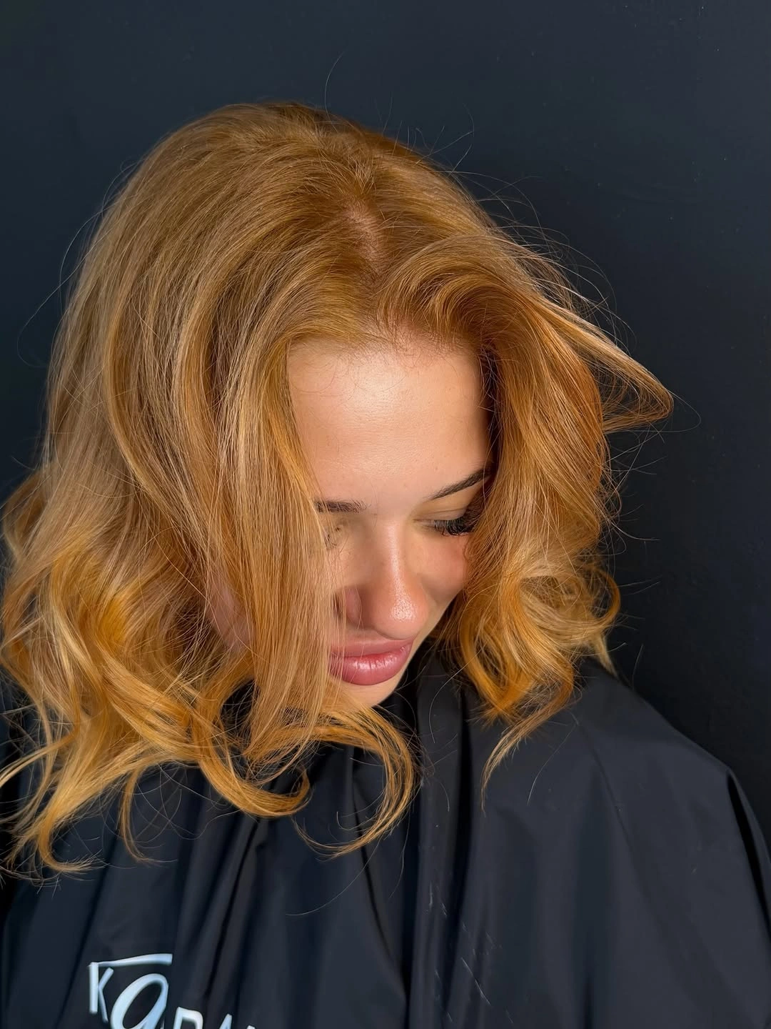 Shoulder length honey copper waves with face framing