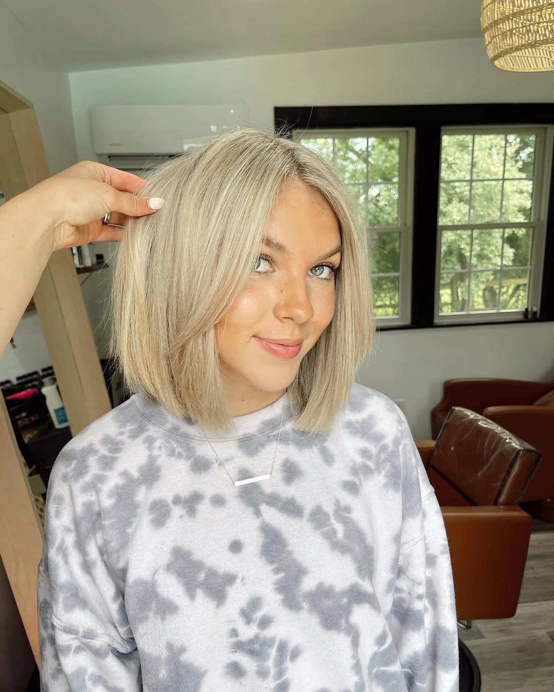Straight pale blonde bob with soft center part