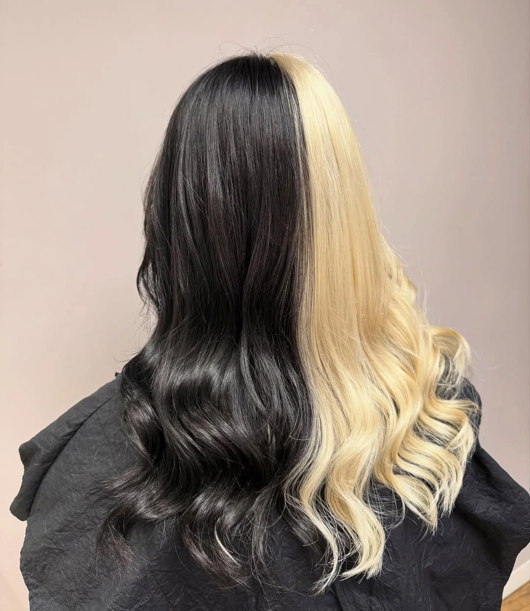 Split black and blonde long hair in loose waves