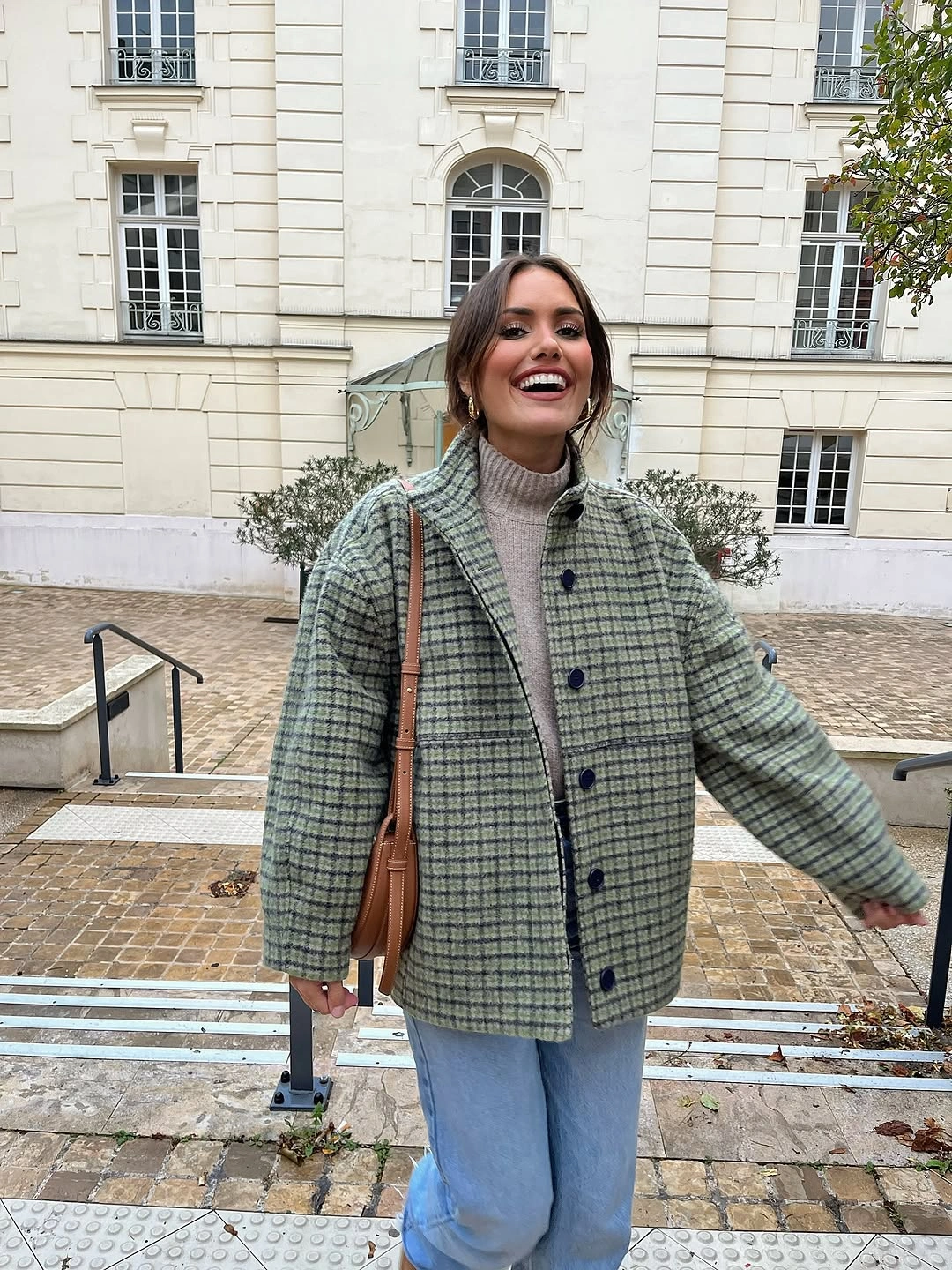 Green checked jacket with light jeans and burgundy bag