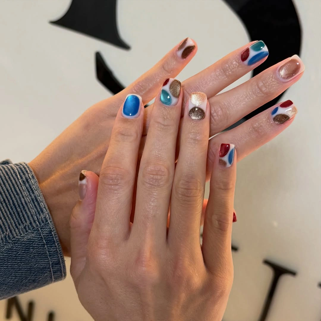 Short square nails with blue red white and metallic blocks