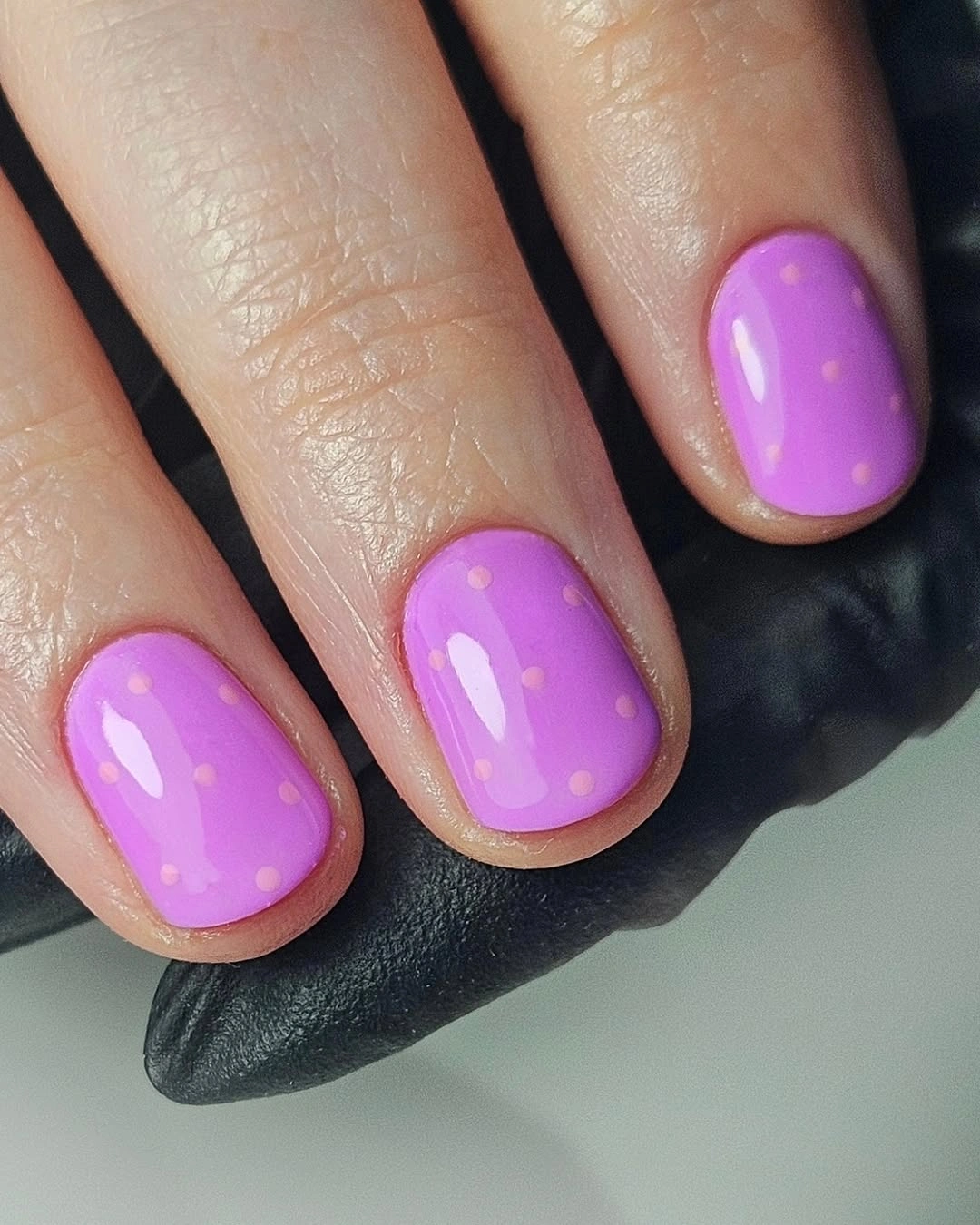 Glossy lavender short nails with tiny warm dot accents