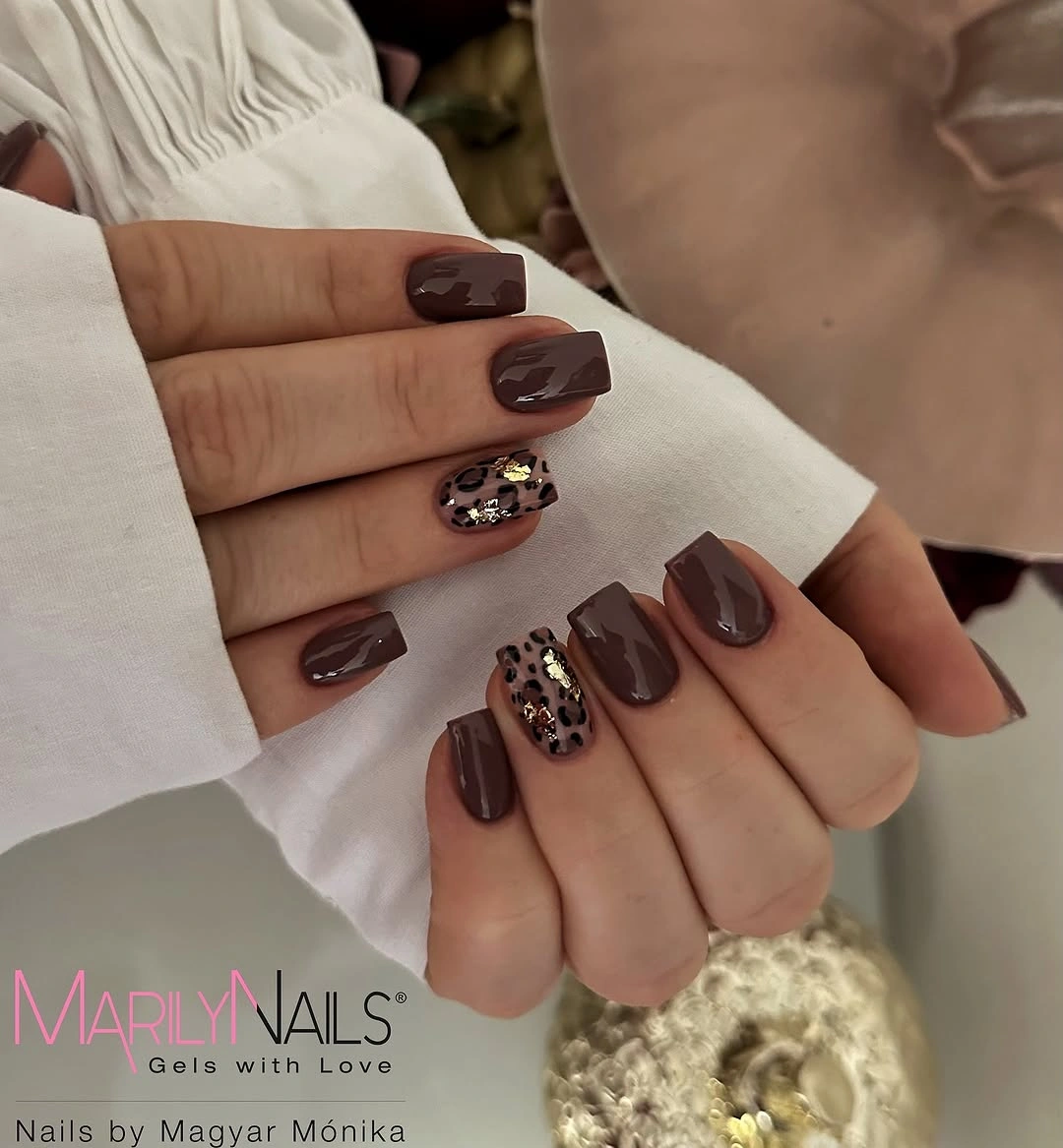 Short chocolate square nails with leopard and gold-flecked accents