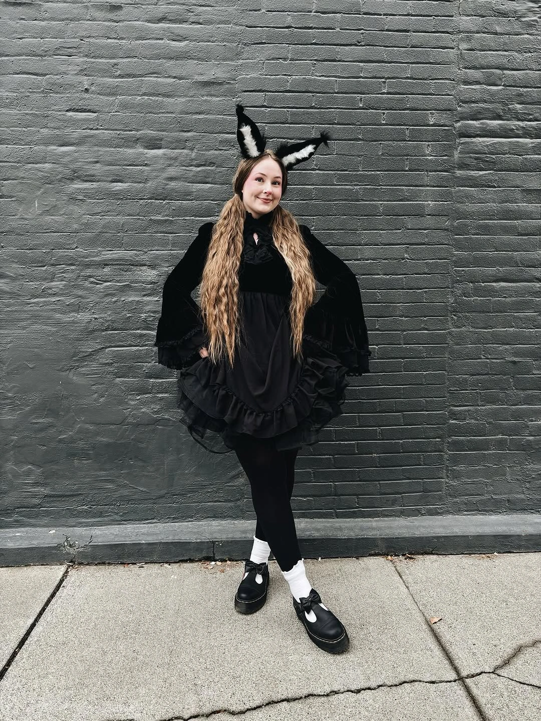 Dark moth fairy costume with sheer wings, antennae, black dress, and Mary Janes