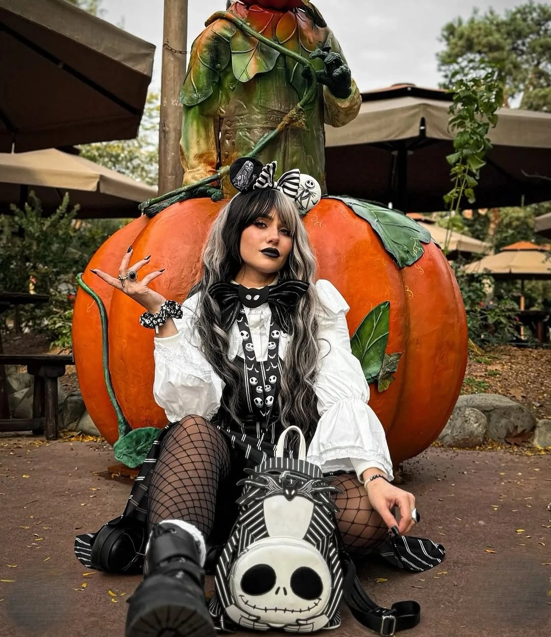 Jack Skellington costume with striped bow, white sleeves, and black corset