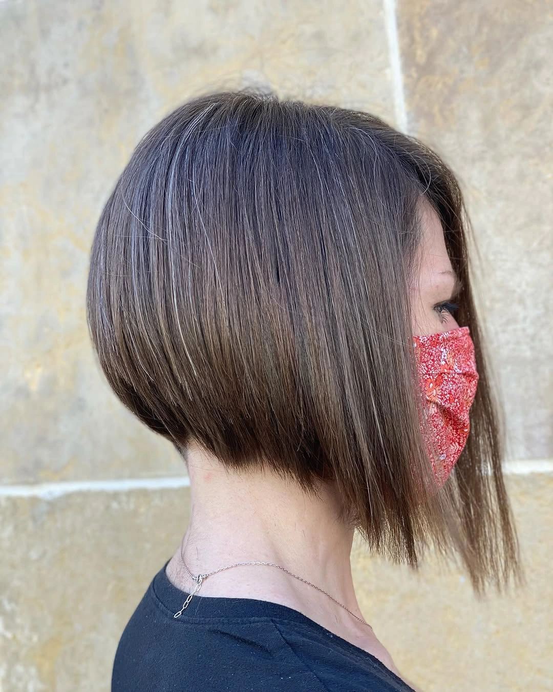 Brunette A-line bob with highlights and long front strand