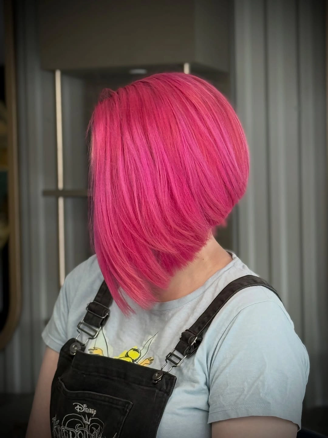 Bright pink A-line bob with long diagonal front sweep