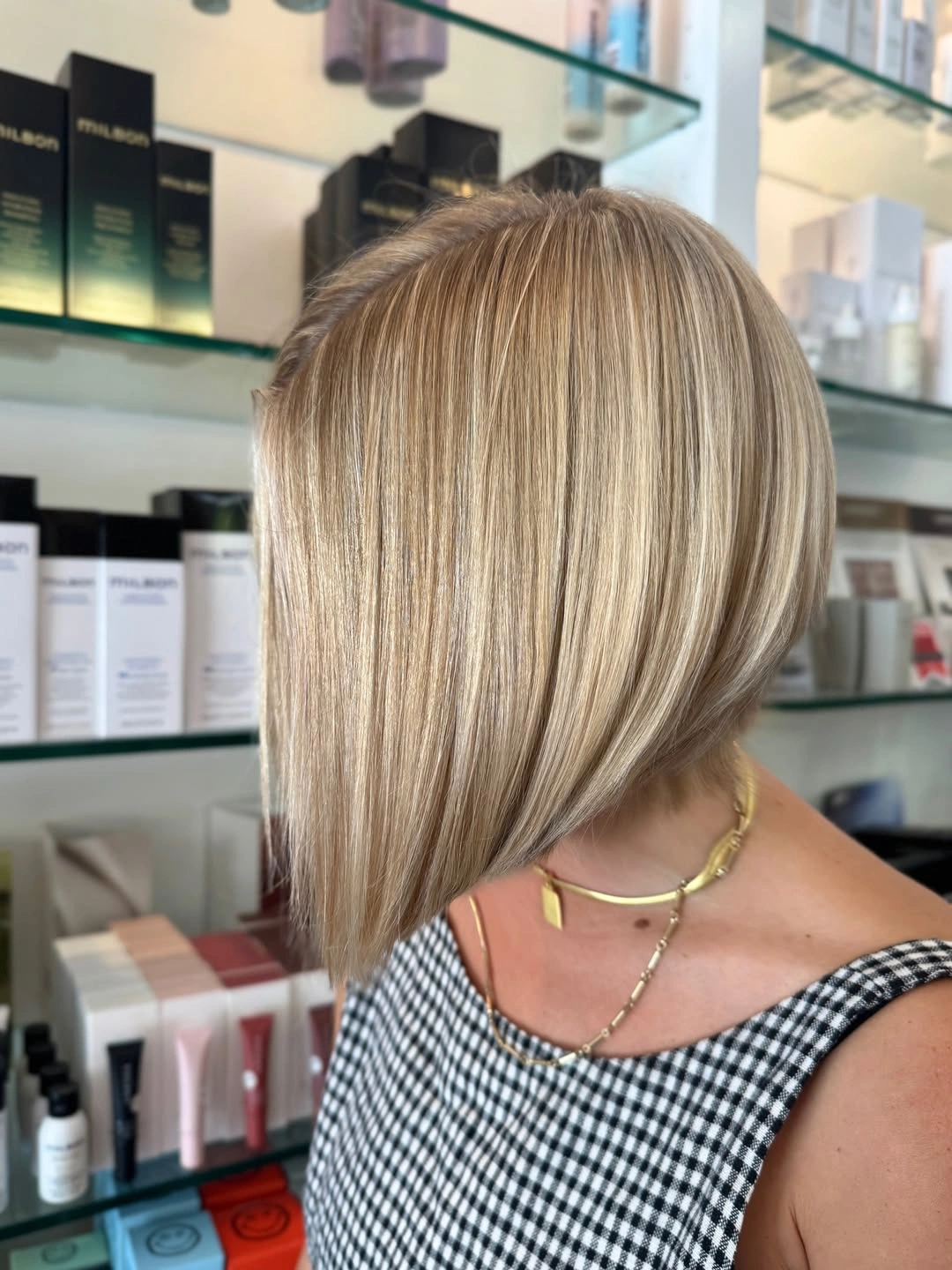 Blonde angled bob with long pointed front and highlights