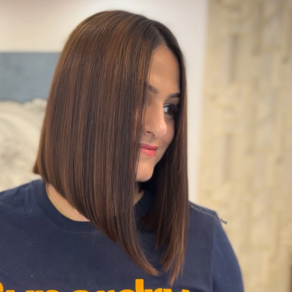 Warm brunette long A-line bob with side part