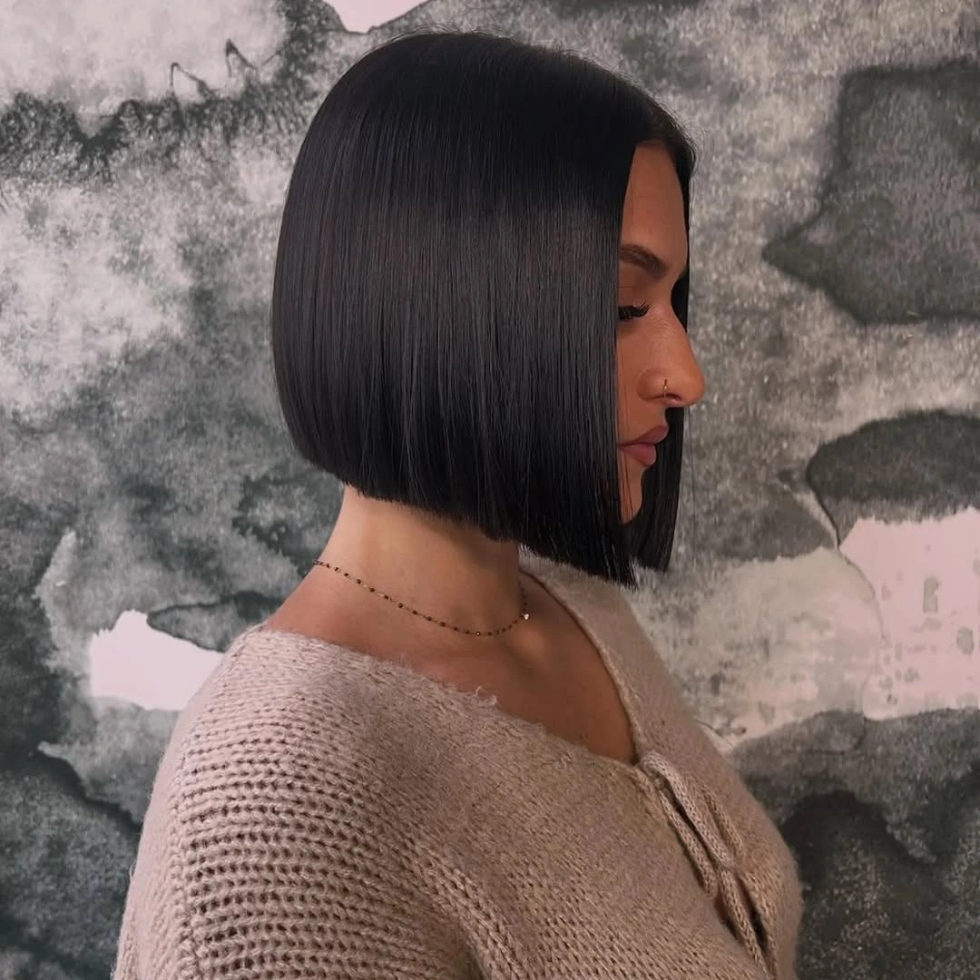 Sleek black A-line bob with blunt chin-level edge