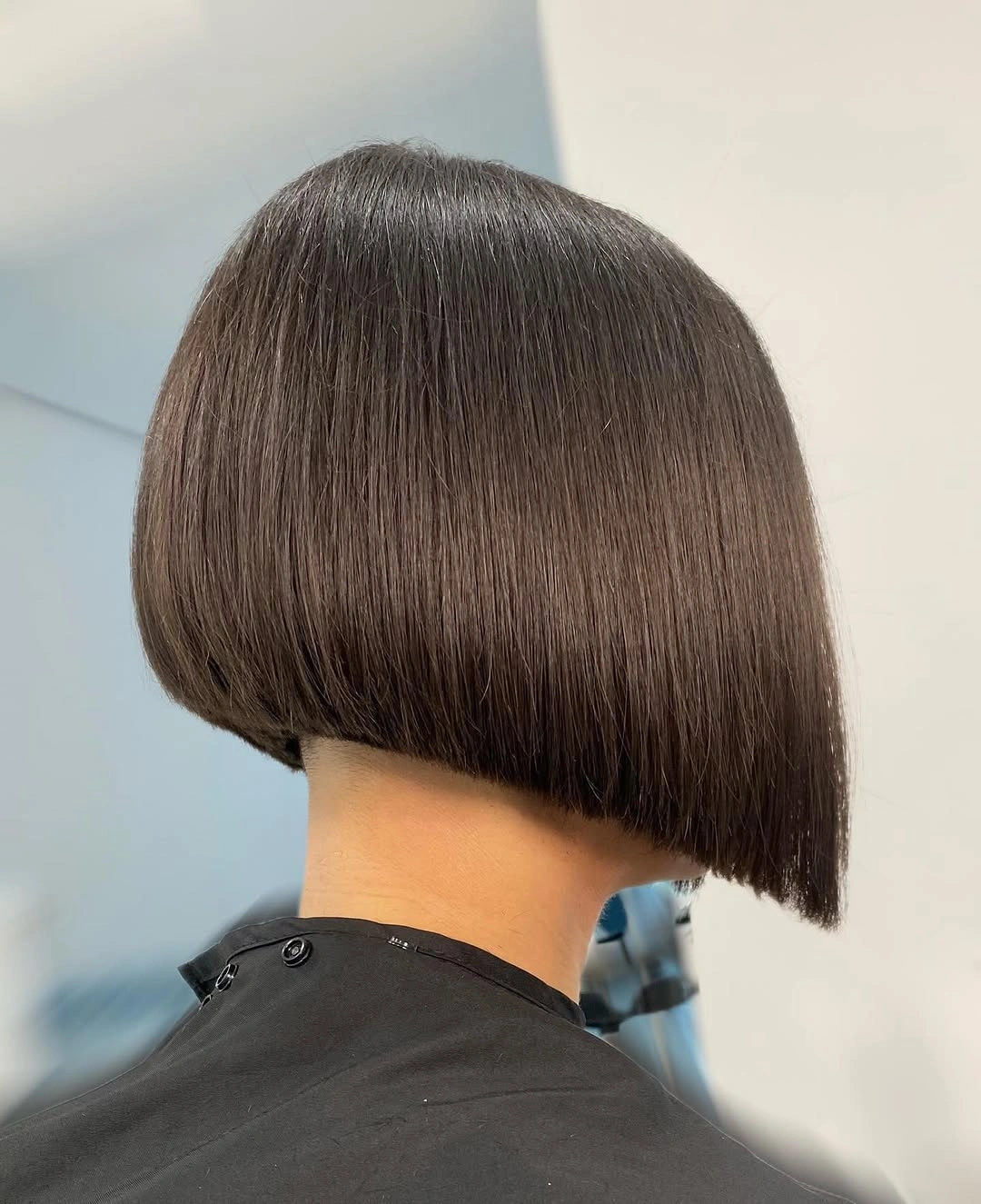 Dark brunette A-line bob with rounded back and blunt edge