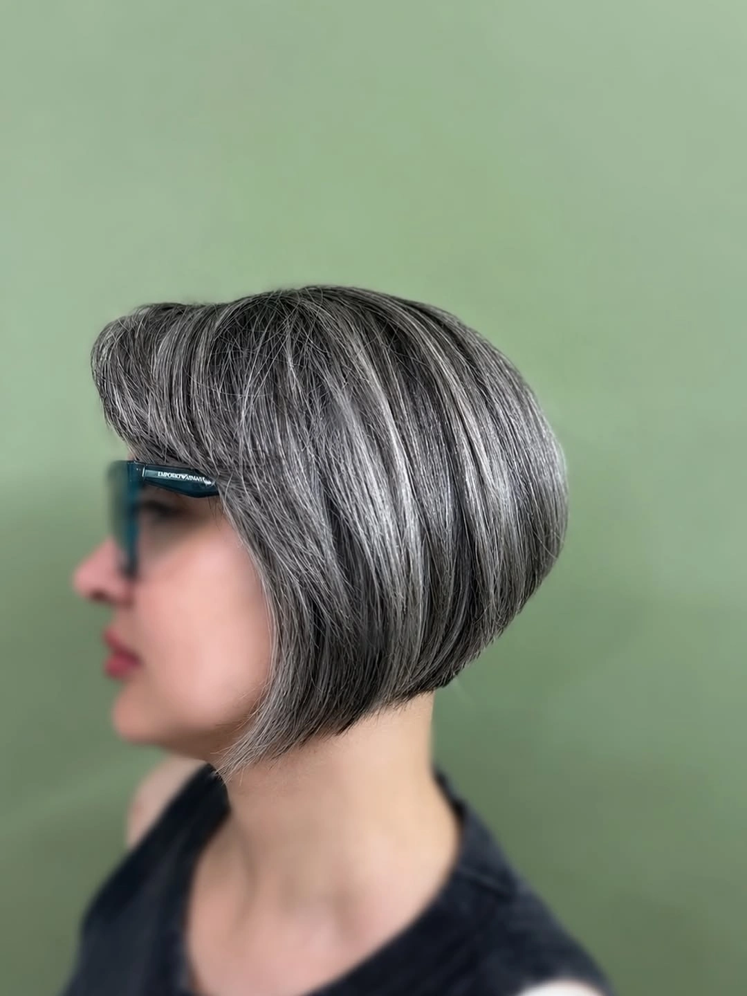 Short silver bob with side-swept bangs and rounded back