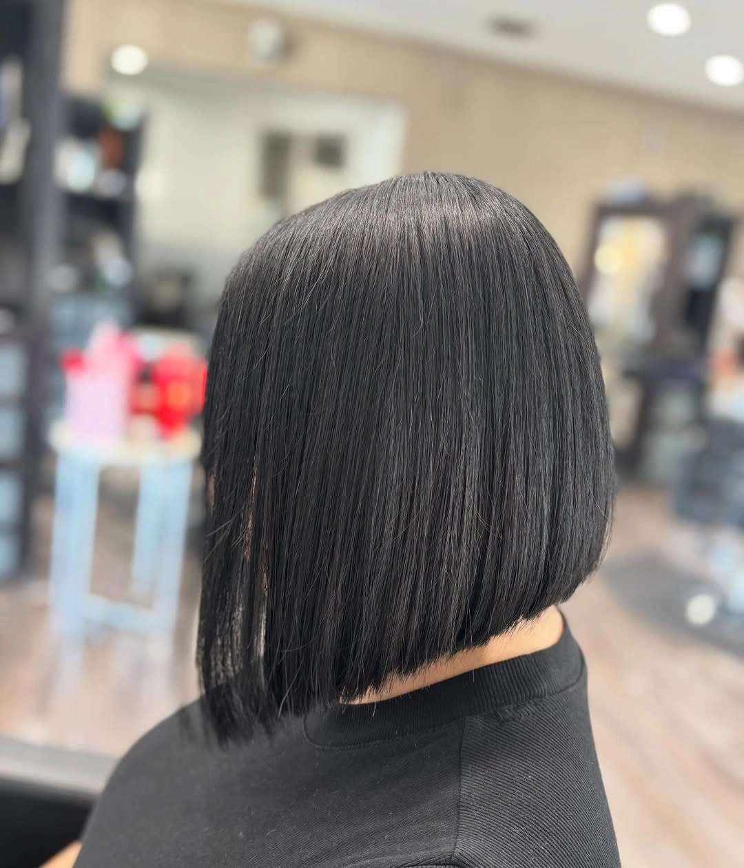 Dark blunt A-line bob with smooth back and longer sides