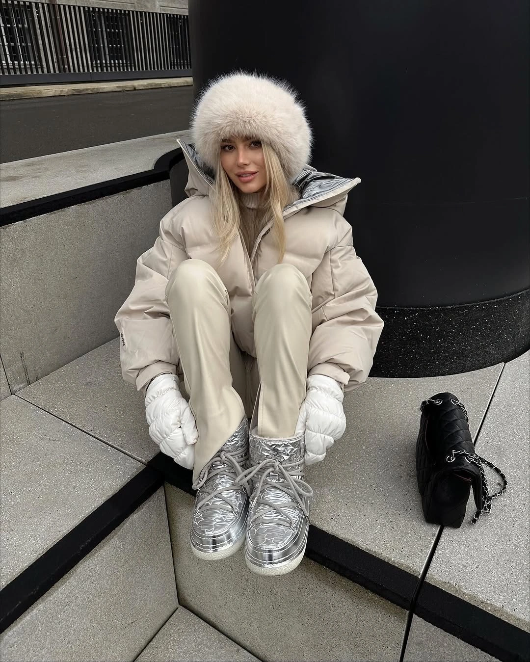 Cream puffer-style jacket with pale trousers and metallic silver platform boots