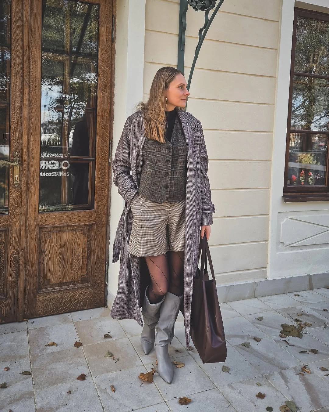 Long gray coat with vest, shorts, tights, and tall boots