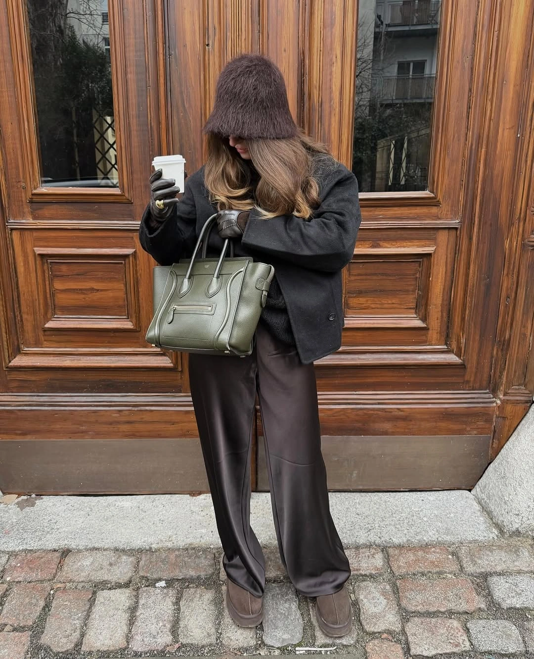 Charcoal blazer black trousers gray knit hat and olive structured bag