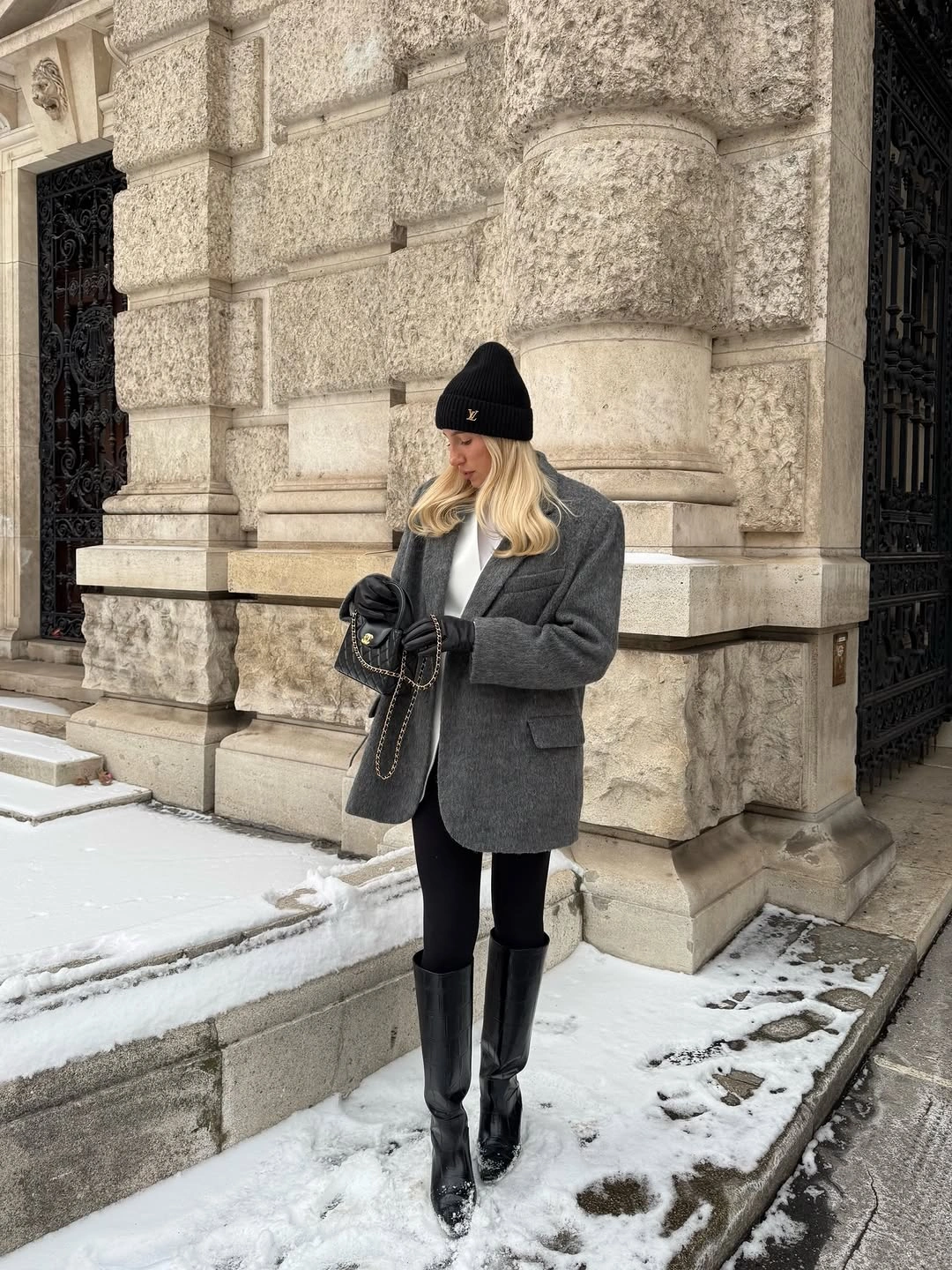 Gray blazer black beanie short dark skirt tall boots and handbag