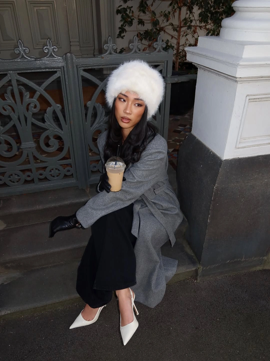 Gray outer layer black midi skirt white boots and white hat