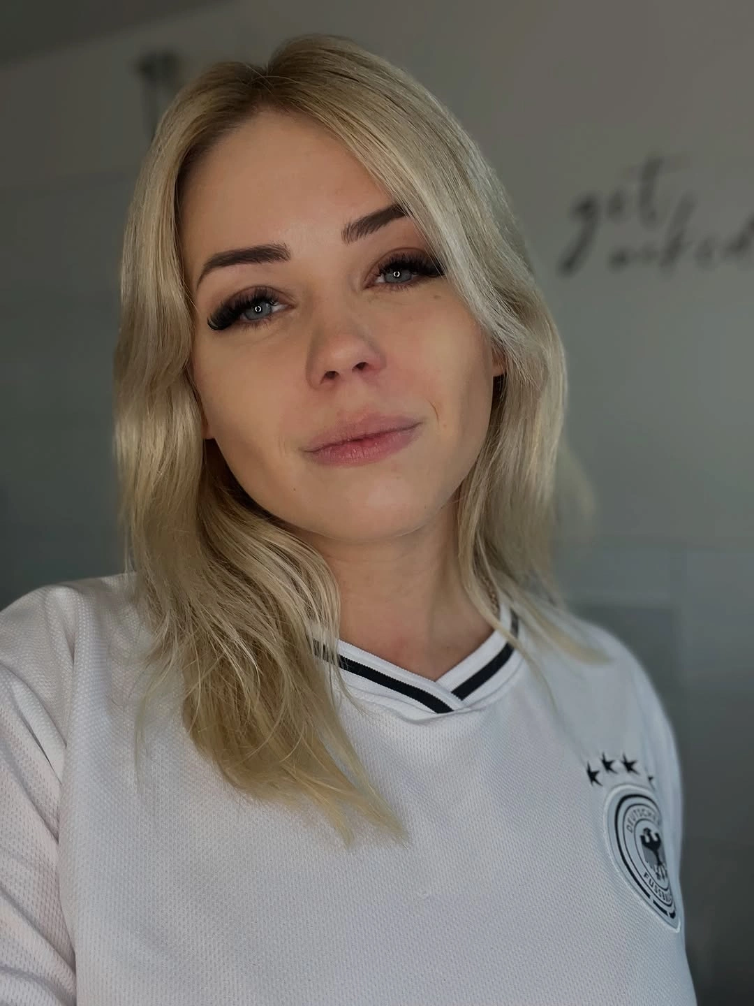 Medium darker blonde hair with soft center part
