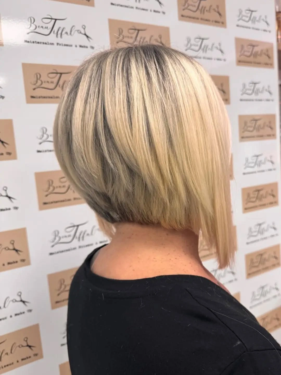 Short rounded blonde bob with darker lowlights