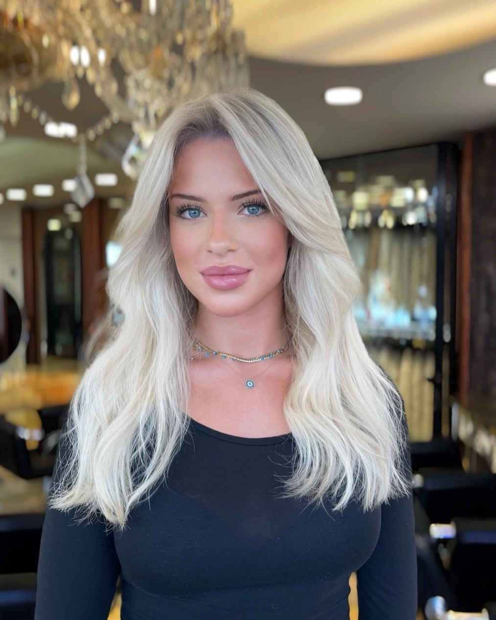 Long icy blonde waves with a center part