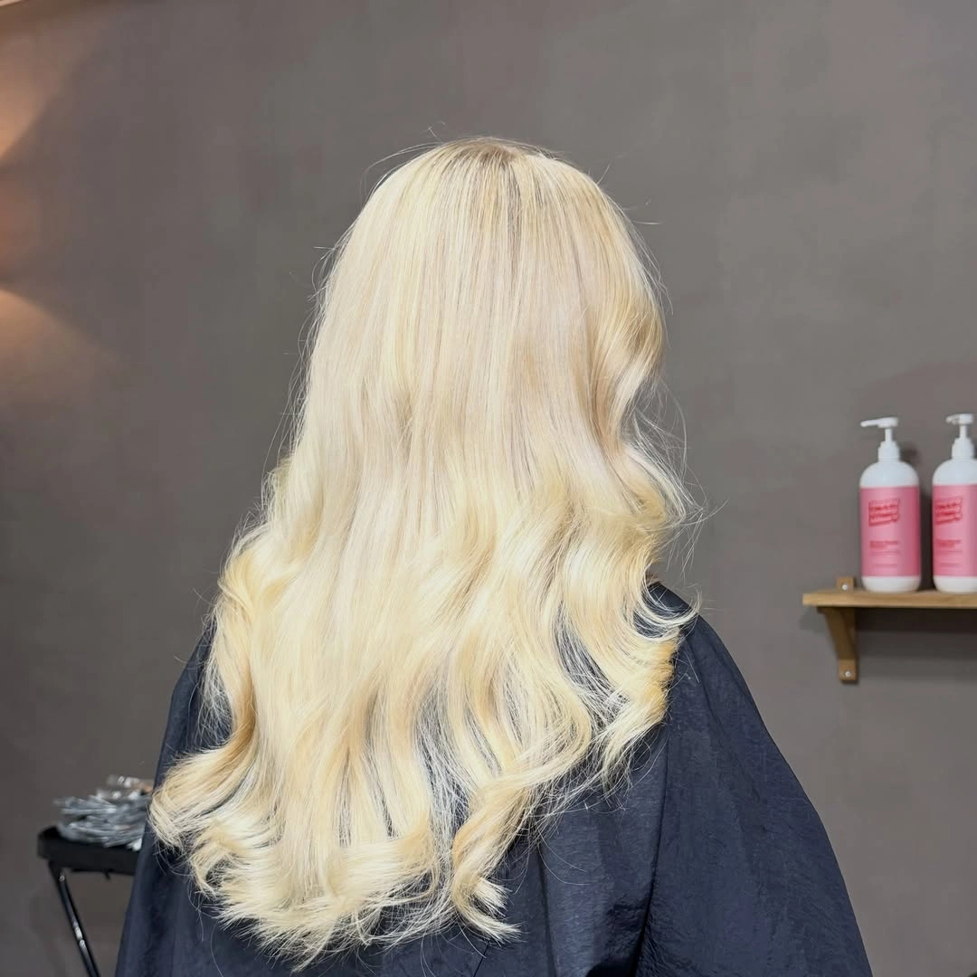 Back view of long warm golden blonde waves