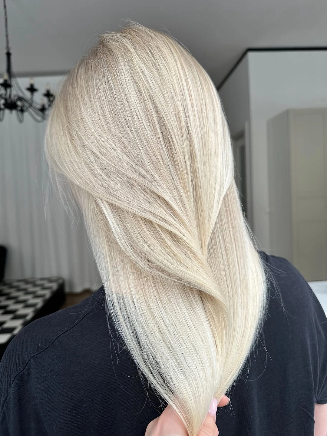 Back view of long layered pale blonde hair