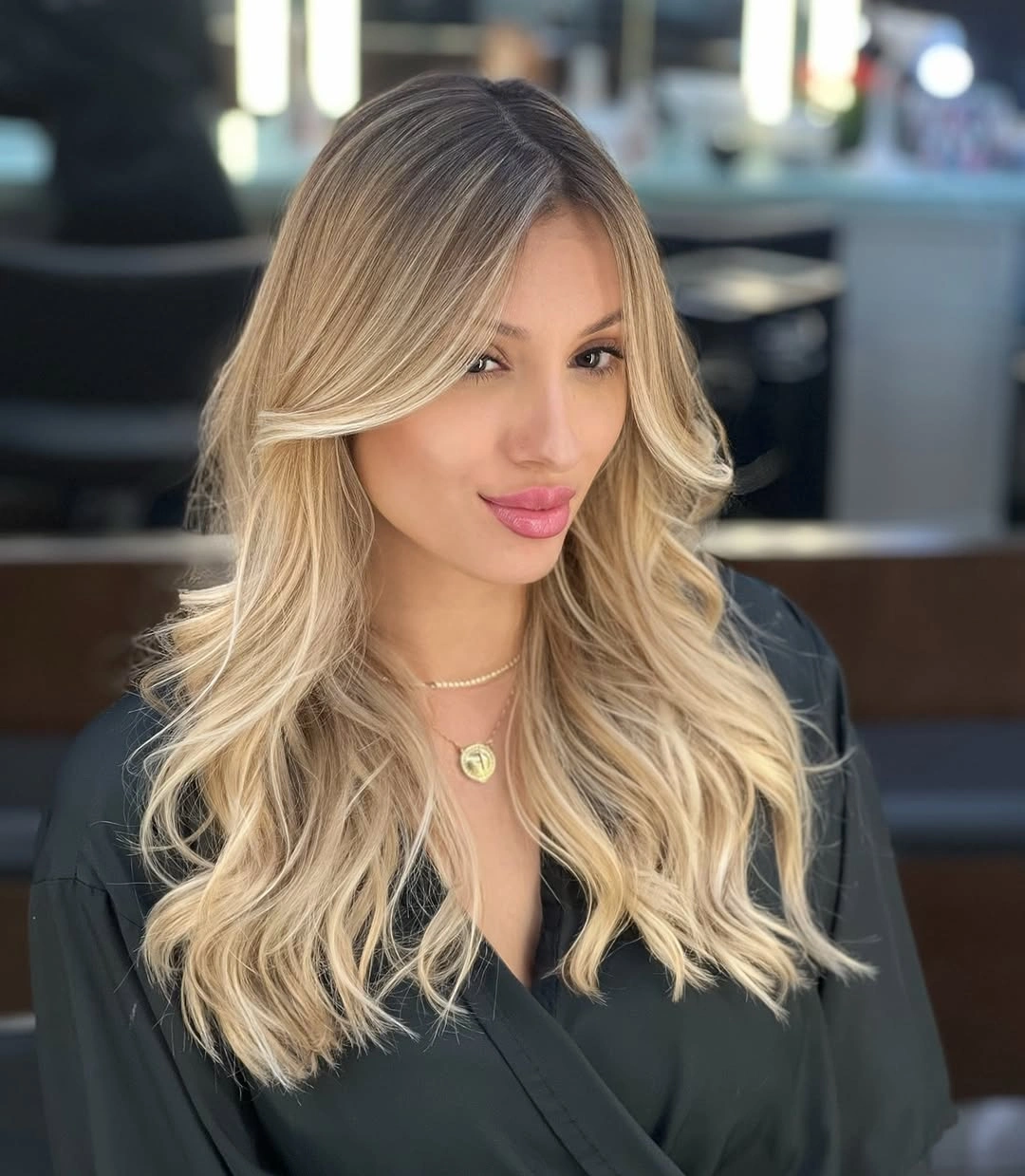 Long wavy blonde hair with darker roots