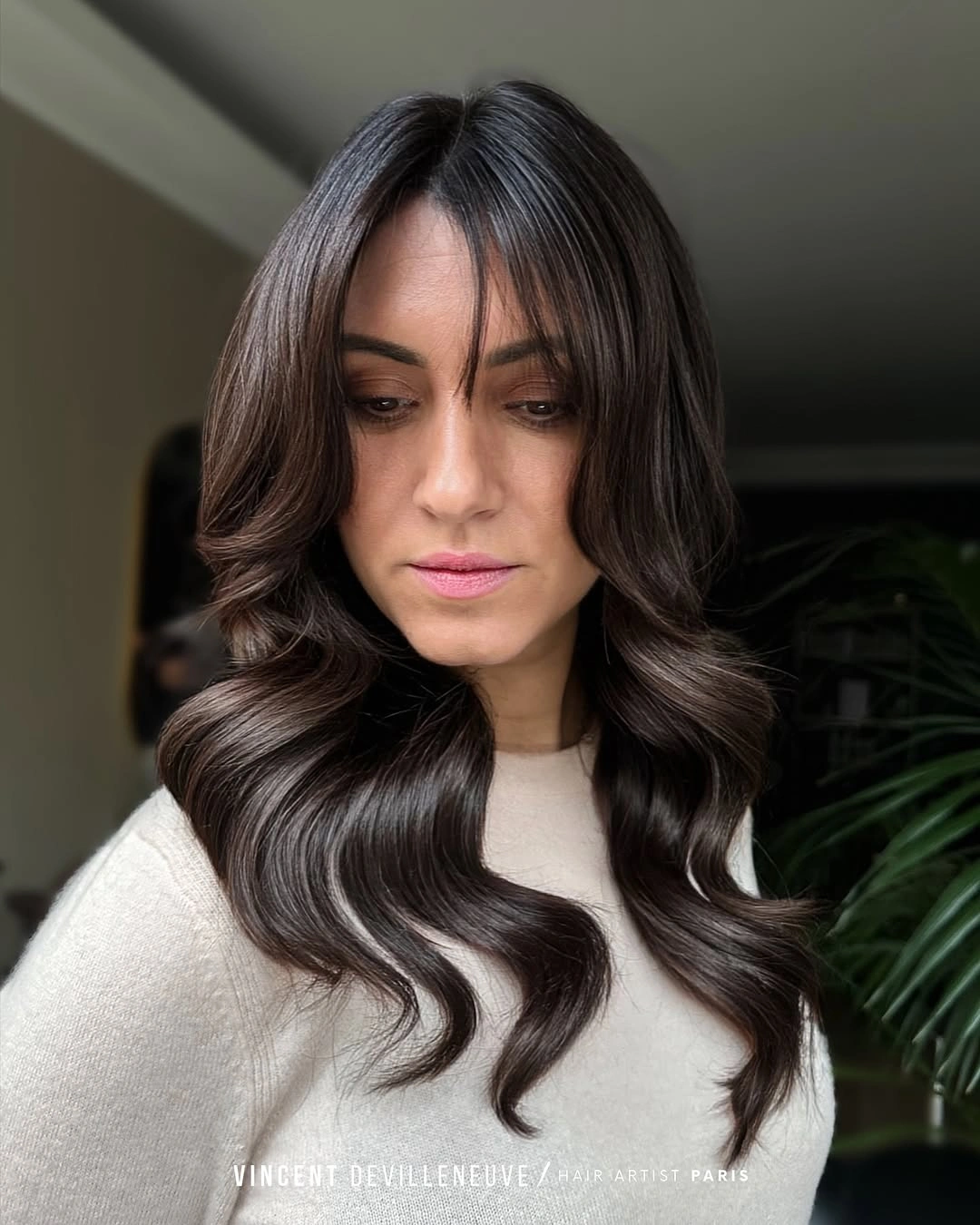 Dark chocolate brunette waves with center part and face layers