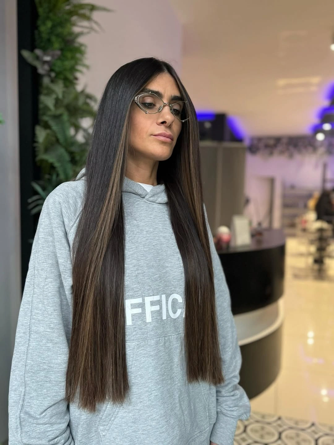 Very long straight brunette hair with narrow beige-brown ribbons