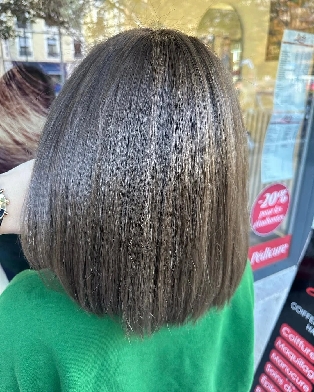 Rounded smoky brunette bob with fine pale vertical strands