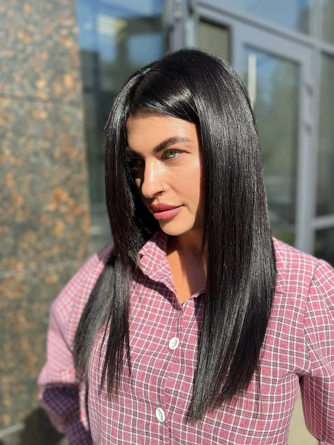 Long near-black brunette hair with side part and glassy shine