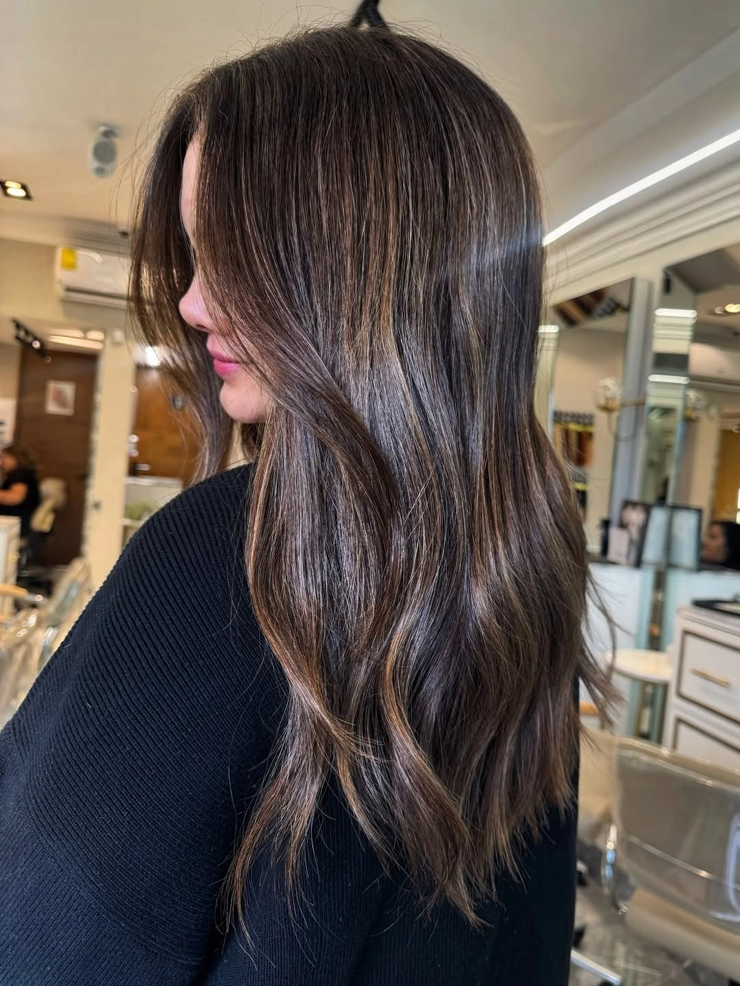 Long dark brunette hair with fine cool beige ribbons