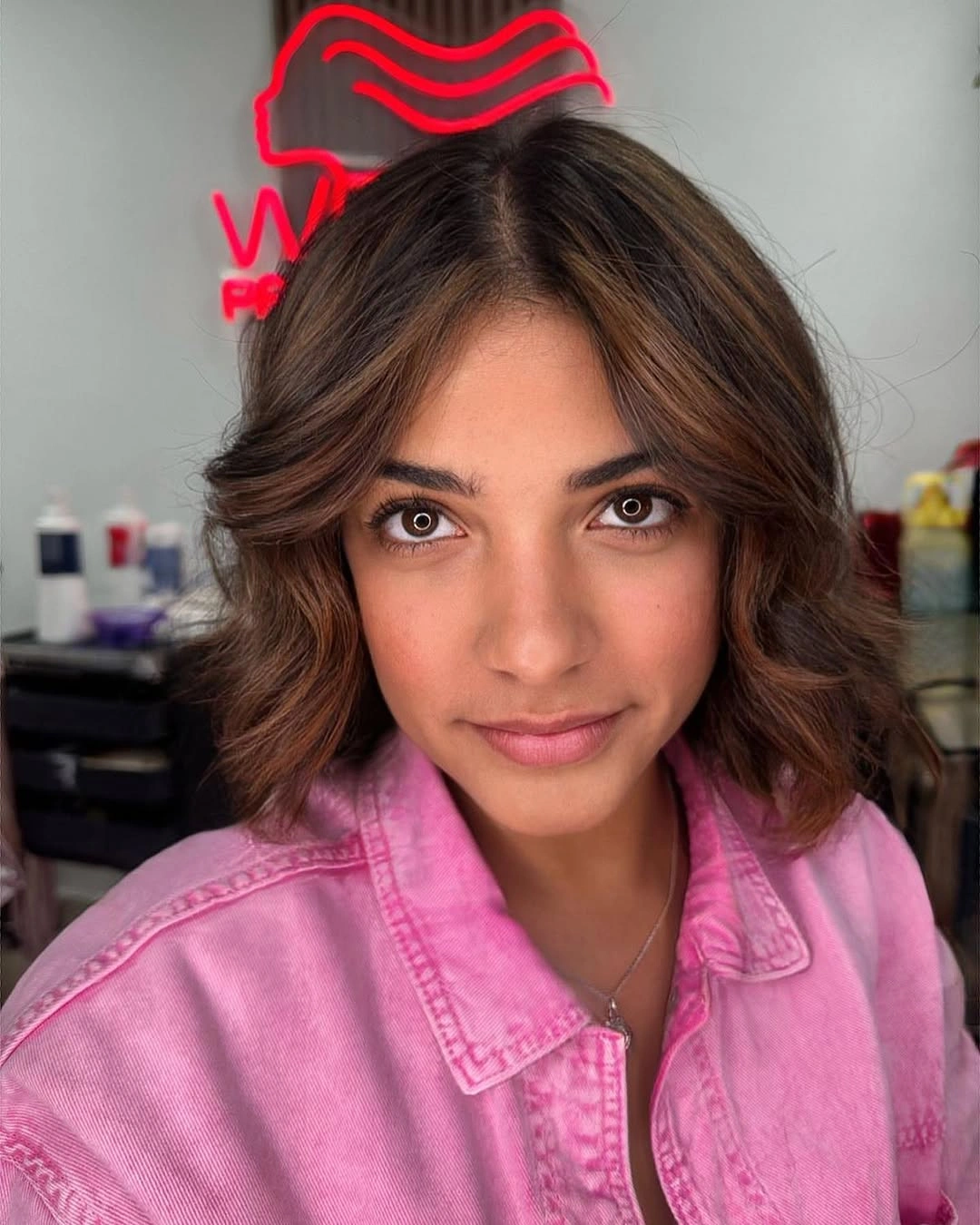 Short wavy brunette bob with warm caramel face pieces