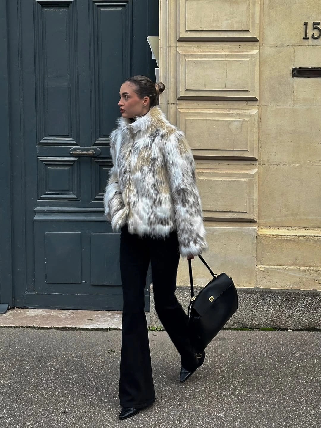 Mottled fluffy jacket with black flared trousers and pointed shoes