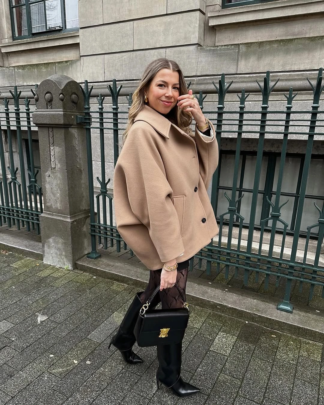 Camel short coat with sheer tights and black knee-high boots