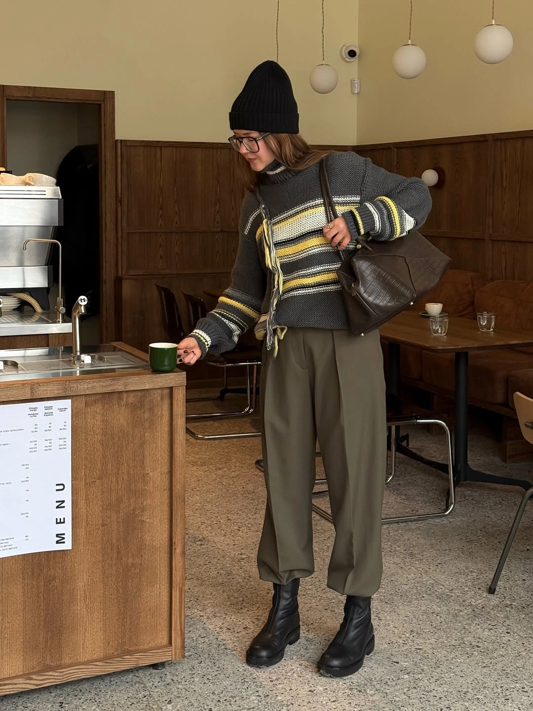 Striped sweater, gray jacket, olive trousers, and black beanie