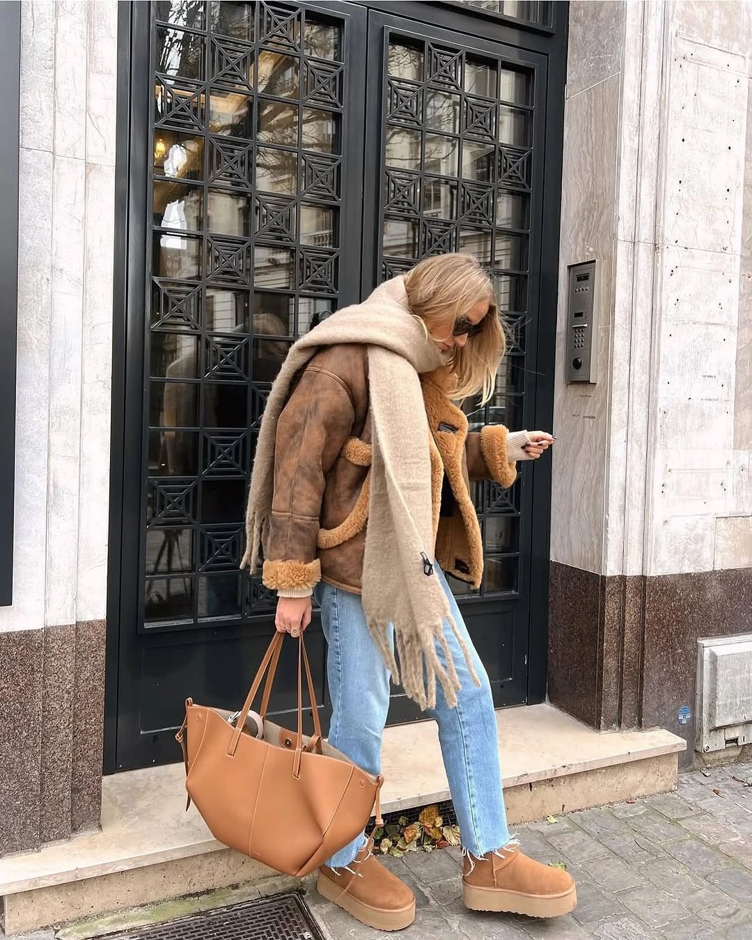 Brown jacket, beige scarf, light jeans, tan boots