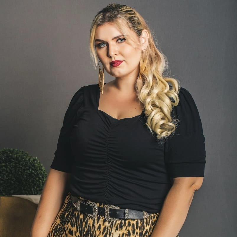 Long blonde curls swept to one side with lifted crown