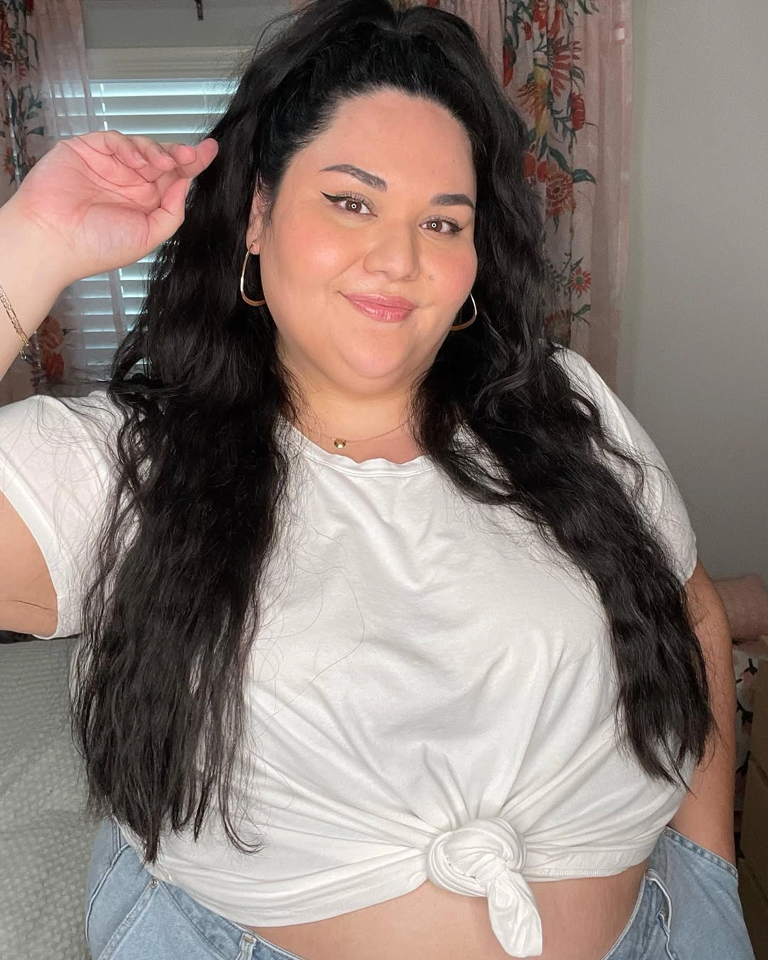 Very long dark wavy hair in high half-up style