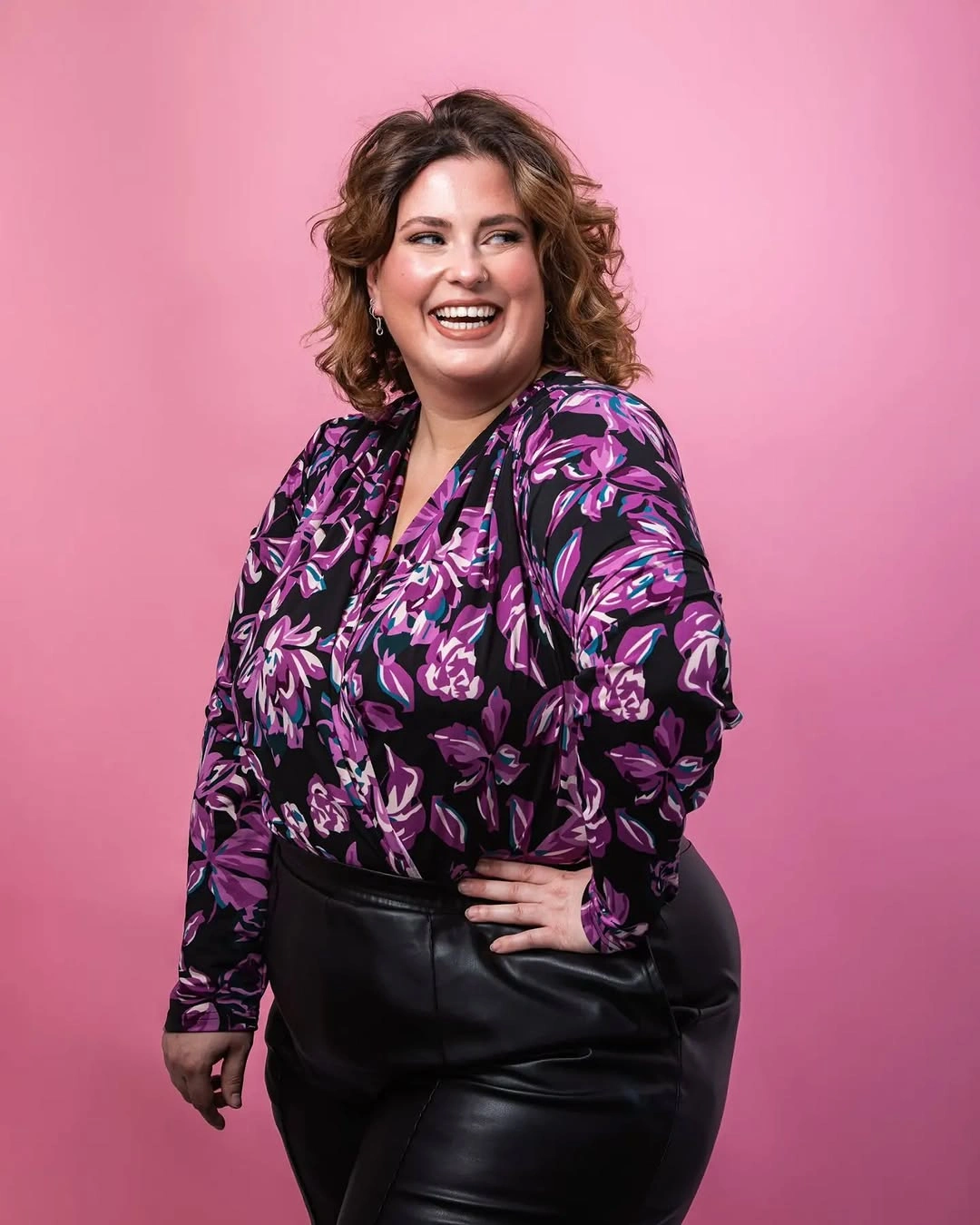 Short-to-medium brown curls with side part and rounded shape