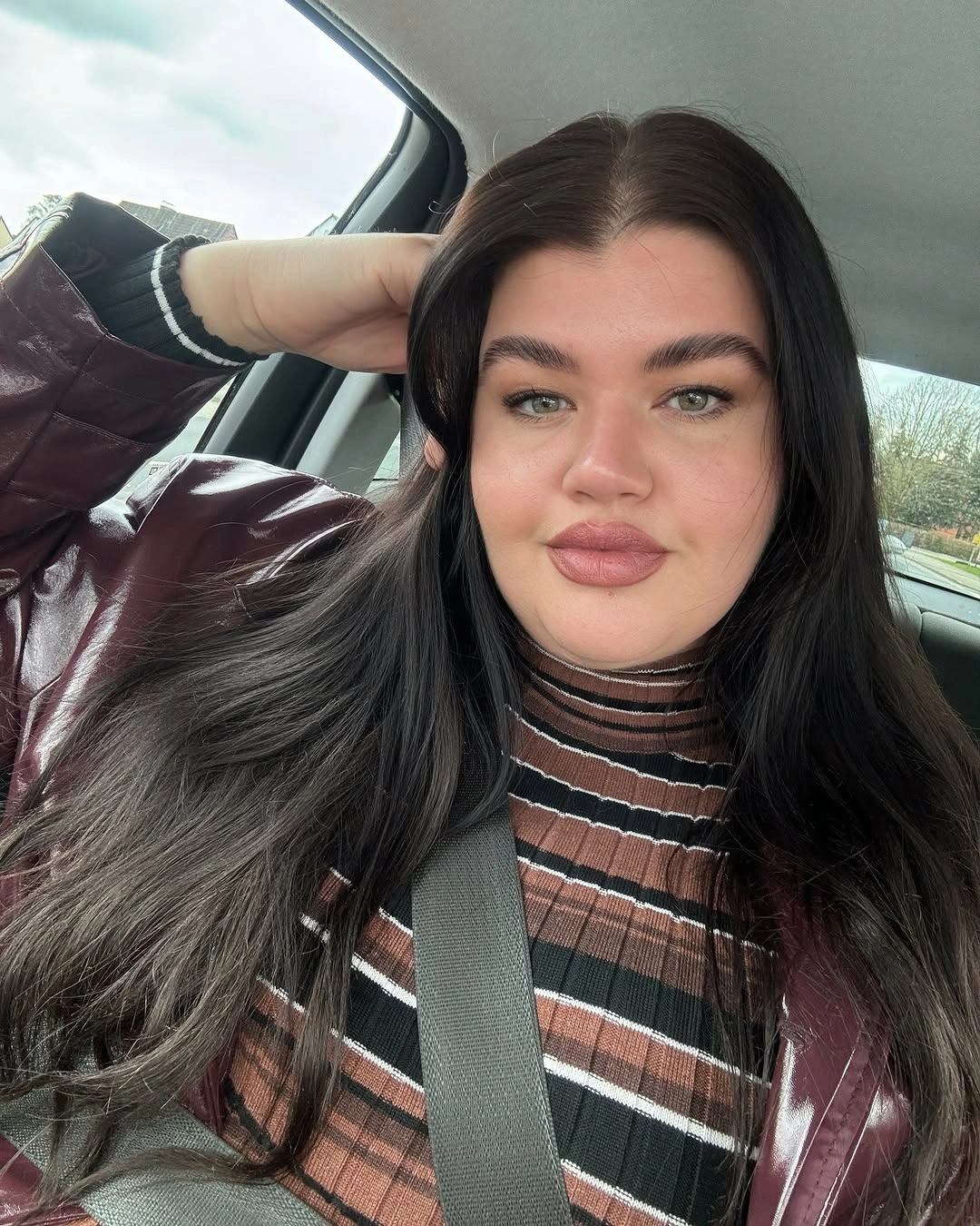 Very long dark hair with center part and smooth top